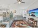 Bright living room features stylish furnishings, decorative accents, and a ceiling fan at 10669 Cardera Dr, Riverview, FL 33578