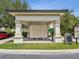 Community mailboxes under a covered area with landscaping and a bulletin board for resident information at 10669 Cardera Dr, Riverview, FL 33578