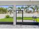 Covered patio provides an outdoor dining area with views of the fenced backyard and lush landscaping at 10669 Cardera Dr, Riverview, FL 33578
