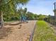 Community playground features modern play equipment and a secure fenced area for safety at 10669 Cardera Dr, Riverview, FL 33578