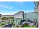 Relax on this stylish balcony with comfortable seating, lush plants, and a stunning cityscape backdrop at 111 N 12Th St # 1805, Tampa, FL 33602