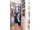 Spacious walk in closet with custom shelving, drawers and storage for optimal organization at 111 N 12Th St # 1805, Tampa, FL 33602