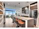 Open kitchen with breakfast bar, stainless steel appliances, and balcony access at 111 N 12Th St # 1805, Tampa, FL 33602
