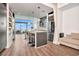 Modern kitchen with stainless steel appliances, a breakfast bar, and hardwood floors at 111 N 12Th St # 1805, Tampa, FL 33602