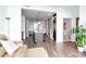 Spacious open-concept living room featuring an island kitchen, a view into the bathroom and hardwood floors at 111 N 12Th St # 1805, Tampa, FL 33602