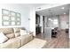 Open-concept living room with hardwood floors and kitchen access at 111 N 12Th St # 1805, Tampa, FL 33602