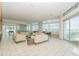 Bright living room area with sofas and large windows offering city views at 111 N 12Th St # 1805, Tampa, FL 33602