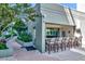 Inviting outdoor bar area with counter seating and lush landscaping and beautiful brick pavers at 111 N 12Th St # 1805, Tampa, FL 33602