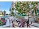 Cozy patio area with table seating, manicured plants, and views of the pool and surrounding area at 111 N 12Th St # 1805, Tampa, FL 33602