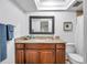 Renovated bathroom featuring granite countertop, modern fixtures, and ample cabinet space at 11245 Bella Loma Dr, Largo, FL 33774