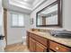 Bathroom with updated granite countertop, vanity, recessed lights, and a tiled shower at 11245 Bella Loma Dr, Largo, FL 33774