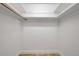Walk-in closet featuring built in shelving and a clothes rod at 11245 Bella Loma Dr, Largo, FL 33774