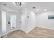 Bright foyer with a decorative glass front door, tile floors and white walls at 11245 Bella Loma Dr, Largo, FL 33774
