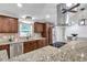 Gorgeous kitchen featuring granite countertops, stainless appliances, and custom cabinetry at 11245 Bella Loma Dr, Largo, FL 33774