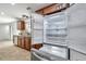 Stainless steel refrigerator is open, showing the kitchen with granite countertops at 11245 Bella Loma Dr, Largo, FL 33774