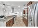An open concept kitchen with modern stainless appliances and lots of storage at 11245 Bella Loma Dr, Largo, FL 33774