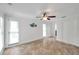 Expansive living room enhanced with decorative wall art, tile floors, and abundant natural light at 11245 Bella Loma Dr, Largo, FL 33774
