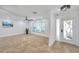 The spacious living room features a decorative front door and large window at 11245 Bella Loma Dr, Largo, FL 33774