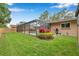 Backyard view of screened pool and lawn at 11245 Bella Loma Dr, Largo, FL 33774