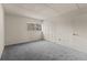 Bedroom showcasing a large window and double closets, perfect for storage and natural light at 11620 Park Blvd # 306, Seminole, FL 33772