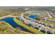 An aerial view of the property showing its proximity to the pond and neighborhood at 13019 Wildflower Meadow Dr, Riverview, FL 33579