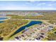 An aerial view of a home with a pond view, showcasing its attractive community at 13019 Wildflower Meadow Dr, Riverview, FL 33579