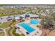 Aerial view of the community pool area with seating and a lap pool at 13019 Wildflower Meadow Dr, Riverview, FL 33579