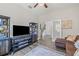 Comfortable living room with dark furniture, a decorative rug, and open view of the staircase at 13019 Wildflower Meadow Dr, Riverview, FL 33579