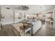 Spacious living room with open layout, neutral decor, and modern furnishings, connecting to the kitchen at 13019 Wildflower Meadow Dr, Riverview, FL 33579