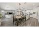 Open-concept kitchen with a large center island flowing into the living room at 13019 Wildflower Meadow Dr, Riverview, FL 33579