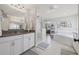 Bright bathroom with double vanities, glass shower, and luxurious soaking tub at 13019 Wildflower Meadow Dr, Riverview, FL 33579