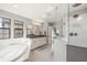 Bright and spacious main bathroom featuring a soaking tub, glass shower, and vanity with storage at 13019 Wildflower Meadow Dr, Riverview, FL 33579