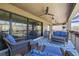 Relaxing covered patio with comfortable seating, ceiling fans, and serene outdoor views at 13019 Wildflower Meadow Dr, Riverview, FL 33579