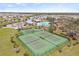 Aerial view of tennis courts with community amenities in the background at 13019 Wildflower Meadow Dr, Riverview, FL 33579