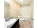 Well-lit bathroom with granite countertops, a soaking tub, and modern fixtures at 13118 Zolo Springs Cir, Riverview, FL 33579