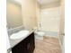 Bathroom featuring a shower-tub combo with granite vanity top at 13118 Zolo Springs Cir, Riverview, FL 33579