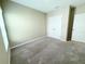 Empty bedroom with neutral carpet and a closet at 13118 Zolo Springs Cir, Riverview, FL 33579