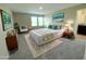Beautiful bedroom with a modern queen-sized bed, soft carpet, accent pillows and decor at 13118 Zolo Springs Cir, Riverview, FL 33579