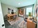 Bright home office with two work stations and a large built-in bookshelf at 13118 Zolo Springs Cir, Riverview, FL 33579