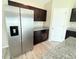 Kitchen featuring stainless steel refrigerator, and granite countertops at 13118 Zolo Springs Cir, Riverview, FL 33579