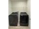 Laundry room with modern appliances and convenient shelving for storage at 13118 Zolo Springs Cir, Riverview, FL 33579