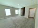 Spacious living room with neutral paint, carpet, and multiple windows at 13118 Zolo Springs Cir, Riverview, FL 33579