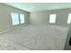Large living room with neutral carpet and multiple windows for natural light at 13118 Zolo Springs Cir, Riverview, FL 33579