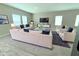 Staged living room with multiple windows and stylish furniture at 13118 Zolo Springs Cir, Riverview, FL 33579