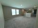 Spacious upstairs loft featuring neutral walls, carpet, and two windows that let in natural light at 13118 Zolo Springs Cir, Riverview, FL 33579