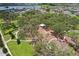 Aerial view of a community park showcasing walking paths, lush trees, and recreational areas at 13128 Foxtail Fern Dr, Riverview, FL 33579