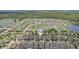 Wide aerial shot of the neighborhood highlighting the community's ponds, well-spaced homes and location pin at 13128 Foxtail Fern Dr, Riverview, FL 33579