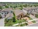 Aerial view of a beautiful, single-story home with manicured lawn in a quiet community at 13128 Foxtail Fern Dr, Riverview, FL 33579