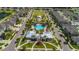 Aerial view of a community pool, clubhouse, park and playground nestled among single-Gathering homes at 13128 Foxtail Fern Dr, Riverview, FL 33579
