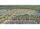 Wide aerial shot of the neighborhood highlighting the community's ponds and well-spaced homes at 13128 Foxtail Fern Dr, Riverview, FL 33579